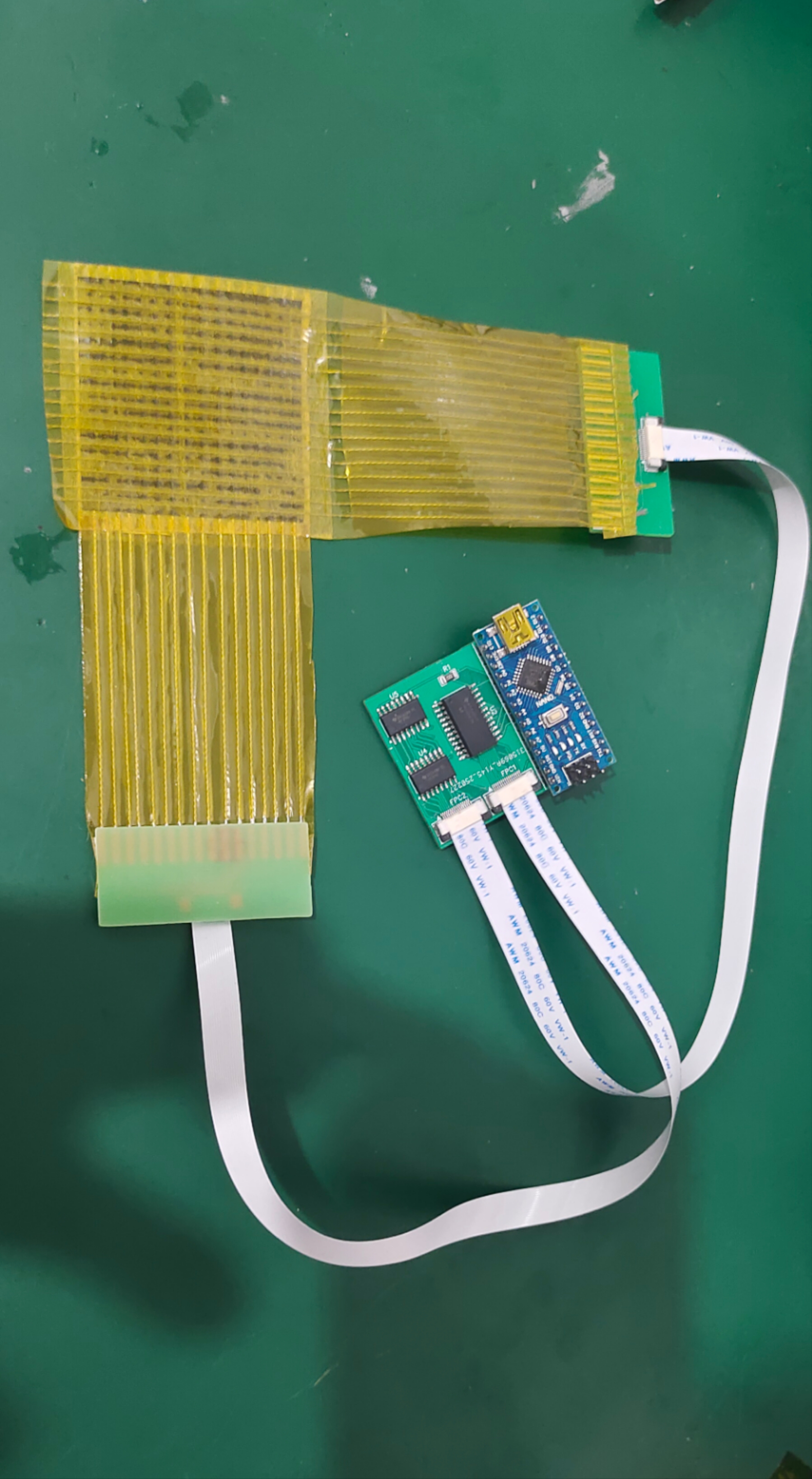 A flexible sensing prototype and its interface electronics on a laboratory workbench
